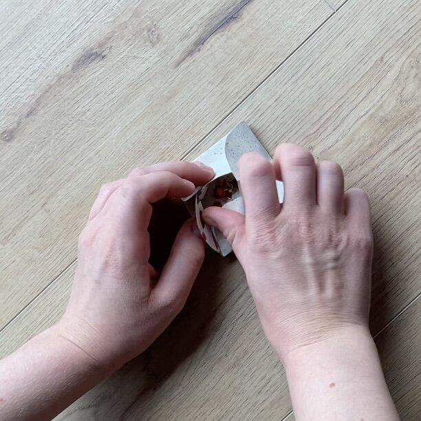 Wrapping loose jewelry pieces in a DIY small package.