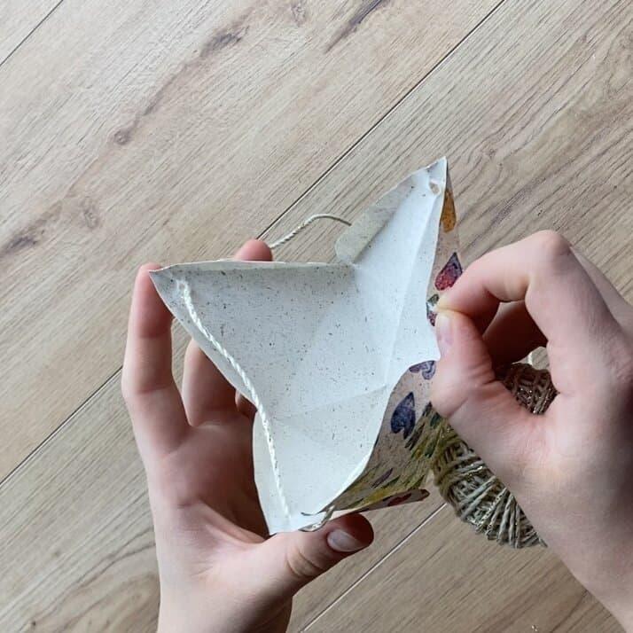 Wrapping loose jewelry pieces in a DIY gift pyramid.