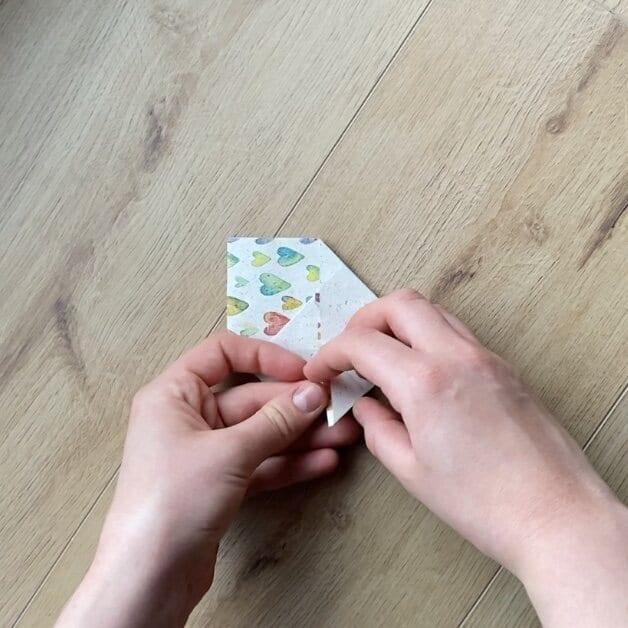 Wrapping loose jewelry pieces in a DIY gift letter package.